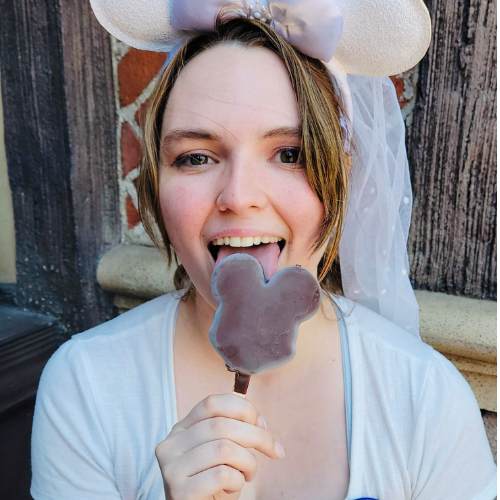Eating a Mickey Ice Cream Bar on our Honeymoon to Disneyland, CA. Summer, 2022.