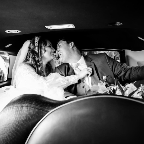 A photo of the two of us In the back of the limo on our wedding day. Photo by Full Frame Photography, Cincinnati, Ohio.