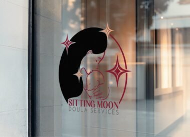 A mock up of the Sitting Moon Doula logo on a window