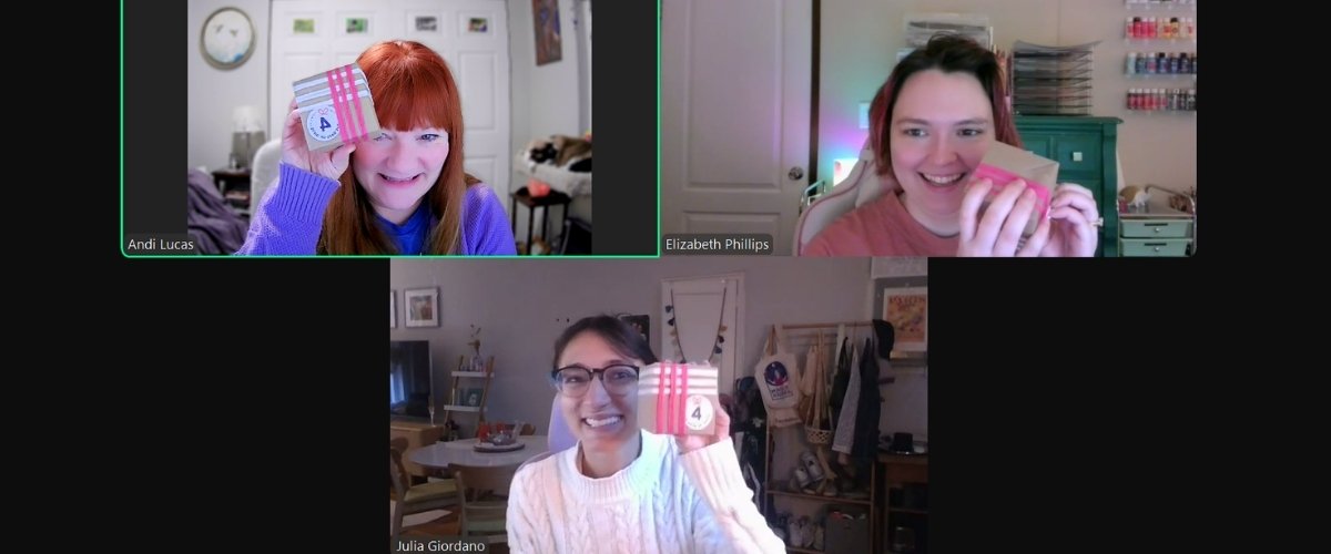 The Hummingbird Marketing Services team shows off their surprise gifts on a video call.