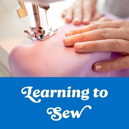 An image of hands running fabric through a sewing machine is great for beginner sewists who are making a vision board that works.