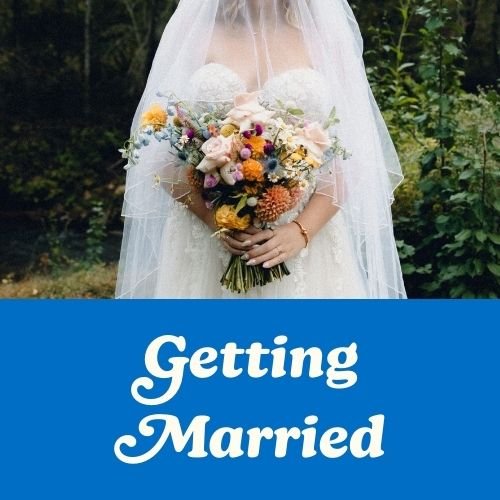 A photo of a bride holding a bouquet is a great image for making a vision board that works to manifest love, marriage, and committment.