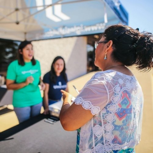 A group of women volunteer at a charity event to exemplify building connection with your target audience. | Social Media Content Strategy 101 - A Blog by Hummingbird Marketing Services