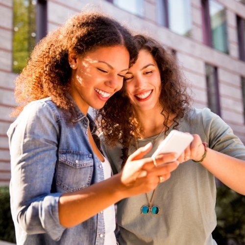 Two women bond over a social media community.