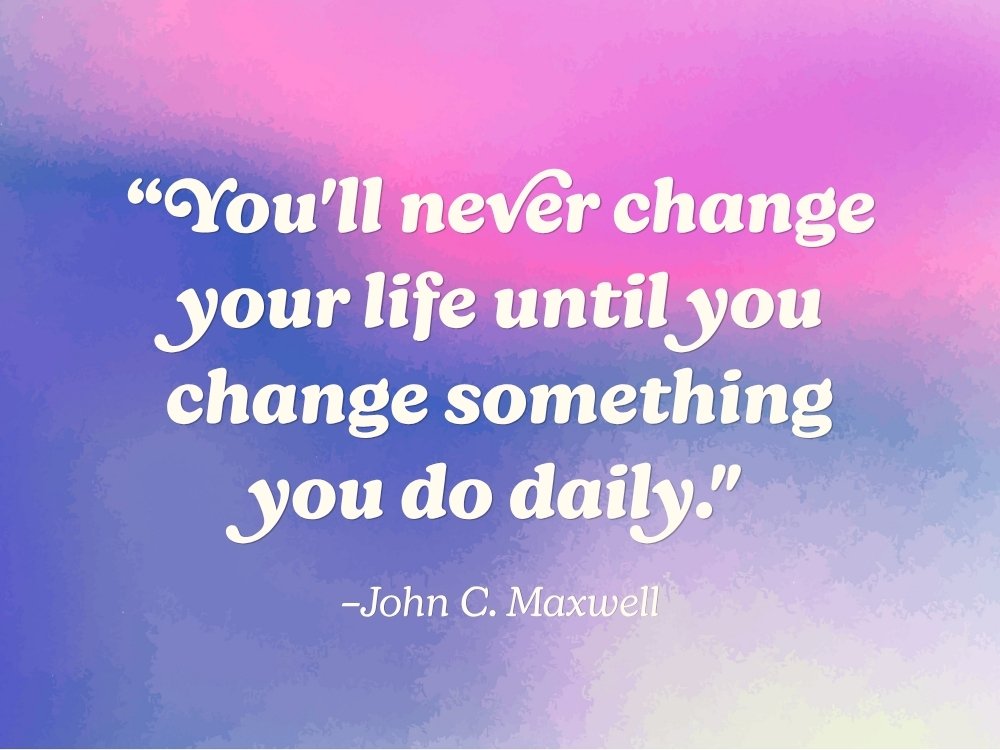 This inspiring quote: “You'll never change your life until you change something you do daily" by John C. Maxwell, against a pink and purple watercolor gradient background. From the blog, How to Avoid Burnout, Writer’s Block, and Creative Slumps by Hummingbird Marketing Services.