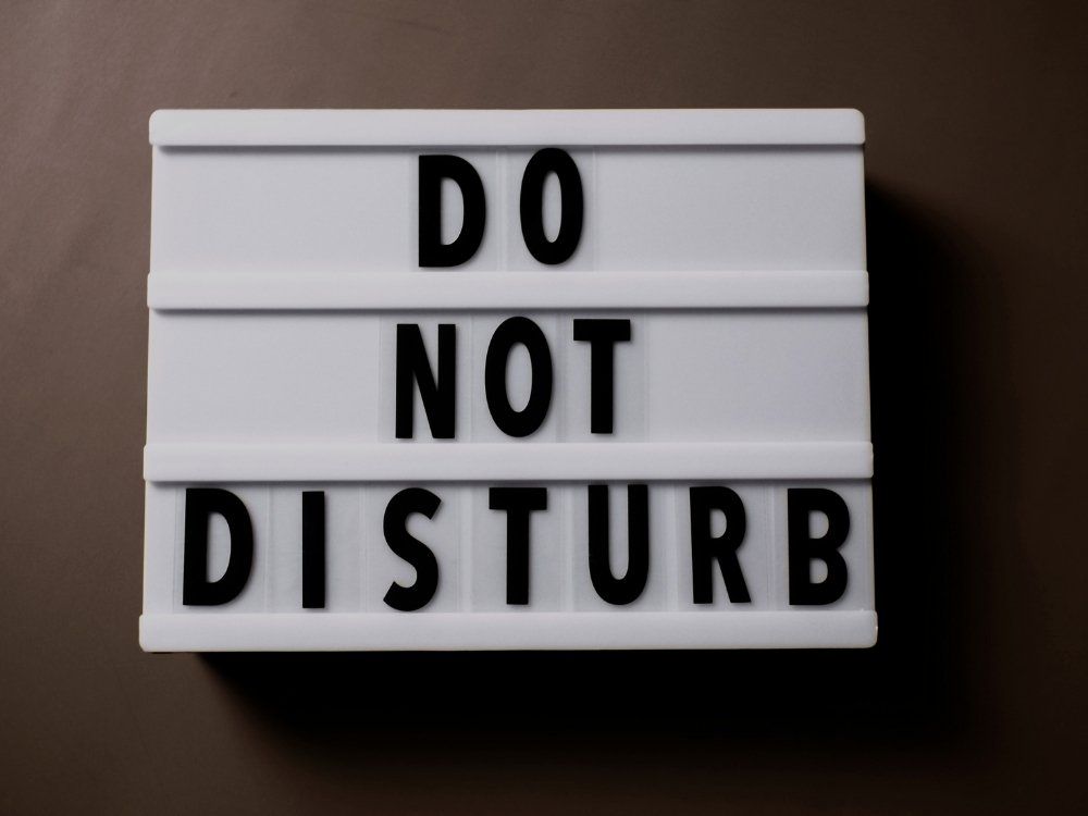 A sign that reads "Do Not Disturb," from the blog, How to Avoid Burnout, Writer’s Block, and Creative Slumps by Hummingbird Marketing Services.