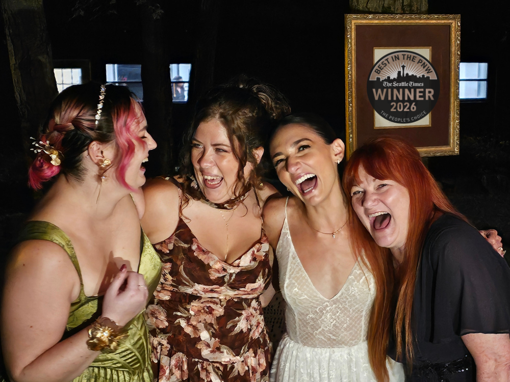 Elizabeth, Sarah, Julia, and Andi of Hummingbird Marketing Services, a woman-owned and operated marketing agency, smiling and laughing